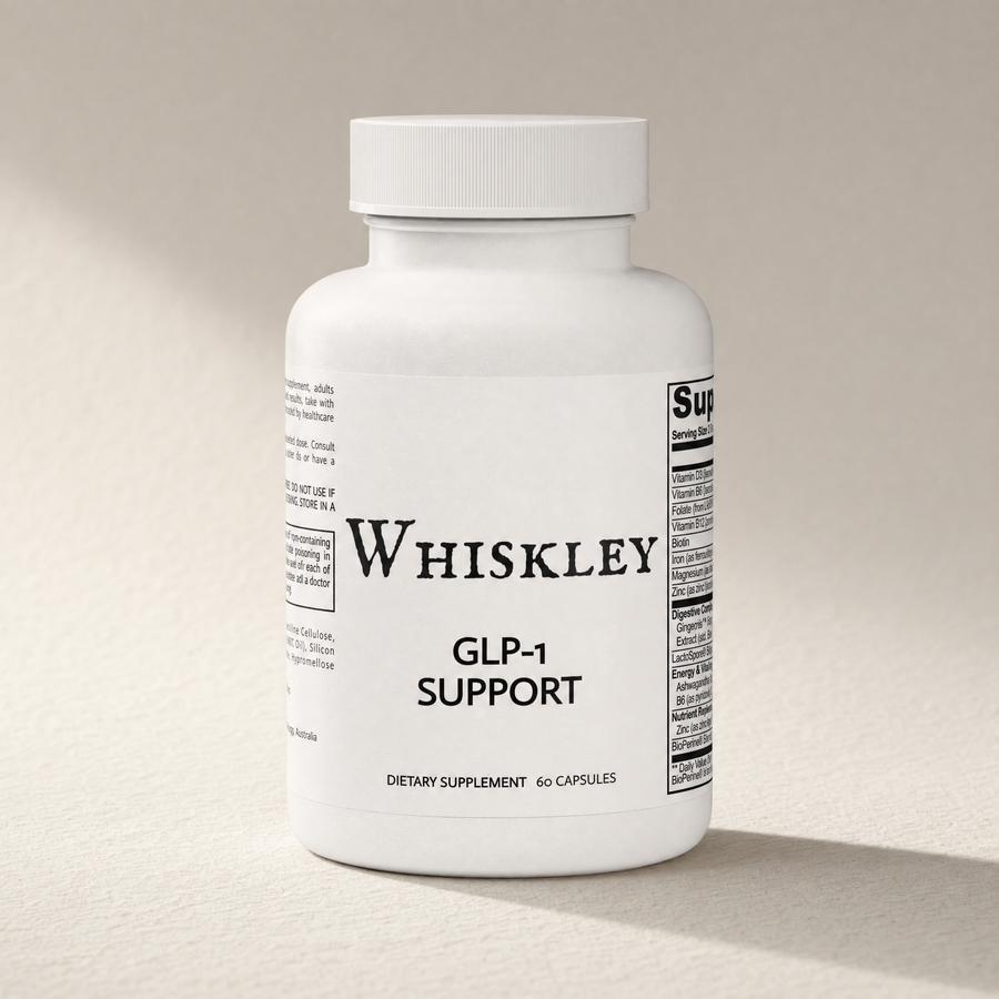 Whiskley GLP-1 Support sealed white supplement bottle with ribbed cap standing on textured washi paper, warm side light and soft shadow